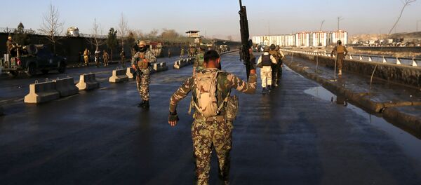 An Afghan security forces holds up his rifle as he walks at the site of an attack in Kabul, Afghanistan February 27, 2016 An Afghan security forces holds up his rifle as he walks at the site of an attack in Kabul, Afghanistan February 27, 2016 - Sputnik International