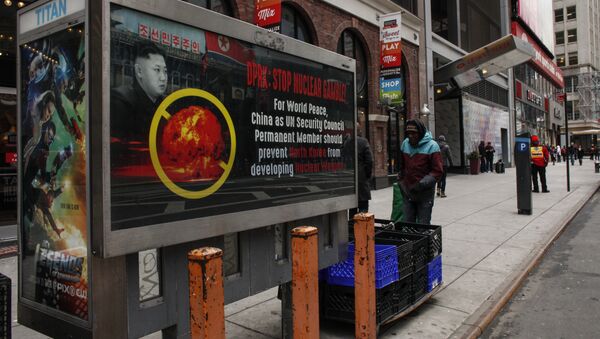 A poster ad that reads : DPRK: STOP NUCLEAR GAMBLE! is displayed on a street near Times Square in New York on February 9,2016 - Sputnik International