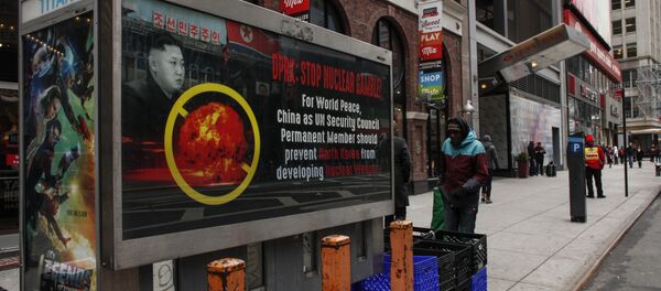 A poster ad that reads : DPRK: STOP NUCLEAR GAMBLE! is displayed on a street near Times Square in New York on February 9,2016 - Sputnik International