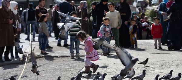 A Syrian girl chases pigeons in Marjeh Square, in Damascus, Syria, Saturday, Feb. 27, 2016 A Syrian girl chases pigeons in Marjeh Square, in Damascus, Syria, Saturday, Feb. 27, 2016 - Sputnik International