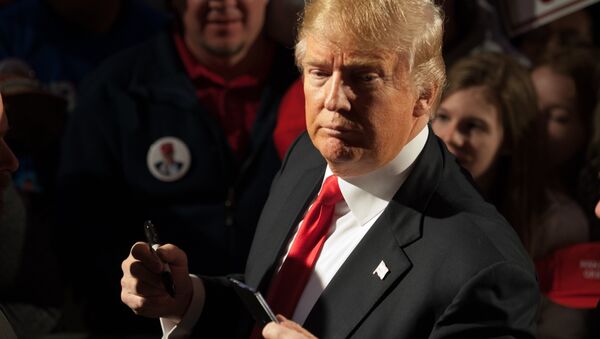 Republican presidential candidate Donald Trump signs autographs for supporters at the conclusion of a Donald Trump rally at Millington Regional Jetport on February 27, 2016 in Millington, Tennessee - Sputnik International