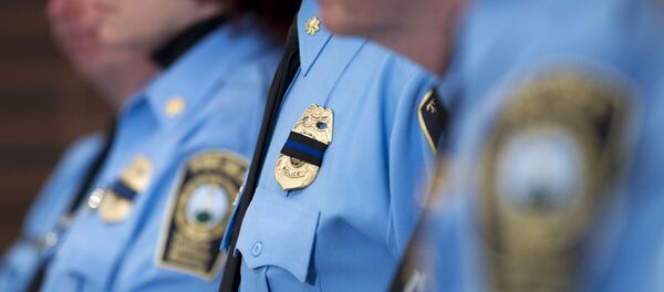 Prince William County Police officers attend a news conference Sunday, Feb. 28, 2016, in Manassas, Va., about a fatal shooting that happened Saturday evening. Ronald Williams Hamilton is being held without bond in the Prince William County Adult Detention Center on charges that include murder of a law enforcement officer. - Sputnik International