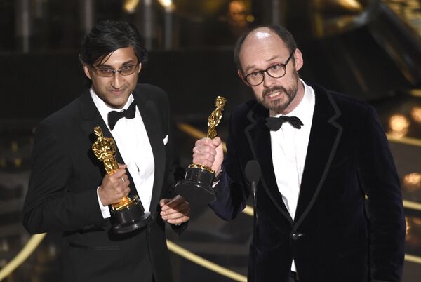 Asif Kapadia, left, and James Gay-Rees accept the award for best documentary feature for “Amy” at the Oscars Asif Kapadia, left, and James Gay-Rees accept the award for best documentary feature for “Amy” at the Oscars - Sputnik International