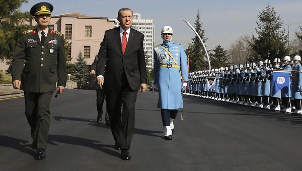 Turkish President Recep Tayyip Erdogan, centre, accompanied by Turkish Forces' Chief of Staff Gen. Hulusi Akar, left, reviews a honour guard Thursday Feb. 18, 2016 - Sputnik International