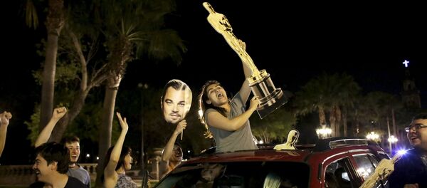 Fans celebrate the win by Alejandro Inarritu for Best Director and Leonardo DiCaprio for Best Actor in his leading role for the movie The Revenant at the 88th Academy Awards in Hollywood, in Monterrey, February 29, 2016 Fans celebrate the win by Alejandro Inarritu for Best Director and Leonardo DiCaprio for Best Actor in his leading role for the movie The Revenant at the 88th Academy Awards in Hollywood, in Monterrey, February 29, 2016 - Sputnik International