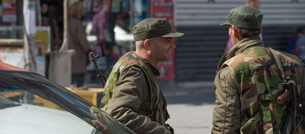 Syrian soldier on a street of Damascus on the first day of truce - Sputnik International