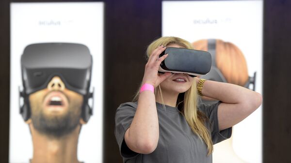A woman uses a virtual reality device. - Sputnik International