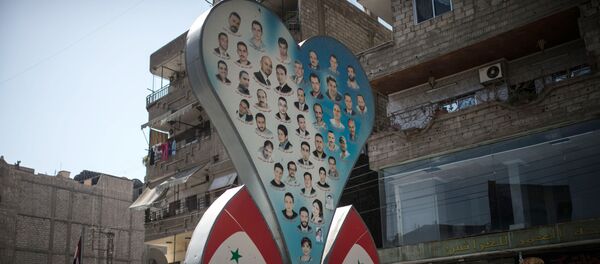 Photos of deceased residents of Damascus on a street of the city - Sputnik International
