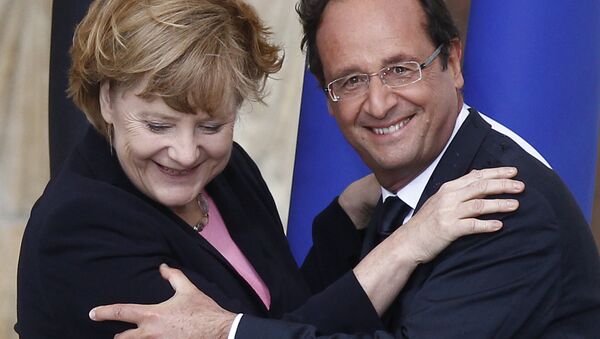 France's President Francois Hollande (R) German Chancellor Angela Merkel are pictured during a ceremony to commemorate the 50th anniversary of renewed Franco-German relations after World War II in Reims. (File) - Sputnik International