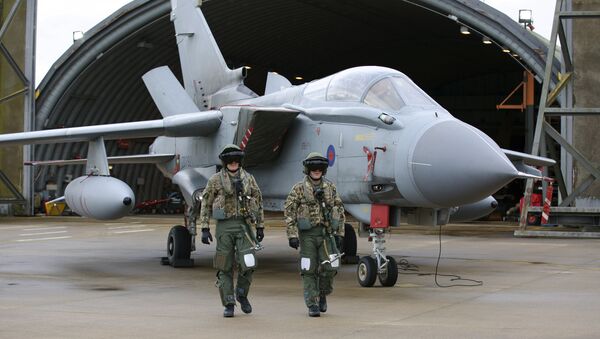 Pilots walk in front of a Tornado GR4 aircraft at the British Royal Air Force airbase RAF Marham in Norfolk in east England on December 2, 2015. - Sputnik International
