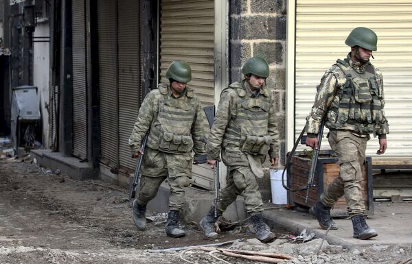 Turkish soldiers patrol in Sur district, which is partially under curfew, in the Kurdish-dominated southeastern city of Diyarbakir Turkish soldiers patrol in Sur district, which is partially under curfew, in the Kurdish-dominated southeastern city of Diyarbakir - Sputnik International