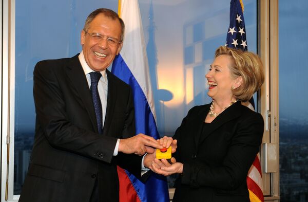 US Secretary of State Hillary Clinton (R) smiles with Russian Foreign Minister Sergei Lavrov after she gave him a device with red knob during a meeting on March 6, 2009 in Geneva. US Secretary of State Hillary Clinton (R) smiles with Russian Foreign Minister Sergei Lavrov after she gave him a device with red knob during a meeting on March 6, 2009 in Geneva. - Sputnik International
