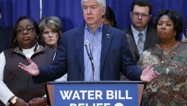 In this Feb. 26, 2016 photo, Gov. Rick Snyder speaks after attending a Flint Water Interagency Coordinating Committee meeting in Flint, Mich. The state of Michigan restricted Flint from switching water sources last April unless it got approval from Gov. Rick Snyder's administration under the terms of a $7 million loan needed to help transition the city from state management, according to a document released Wednesday, March 2, 2016. - Sputnik International