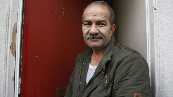 Iranian asylum seeker Mohammed Bagher Beyzevi poses for a photograph outside his home on Union Street in Middlesbrough, northern Britain, in this file photograph dated January 20, 2016. - Sputnik International