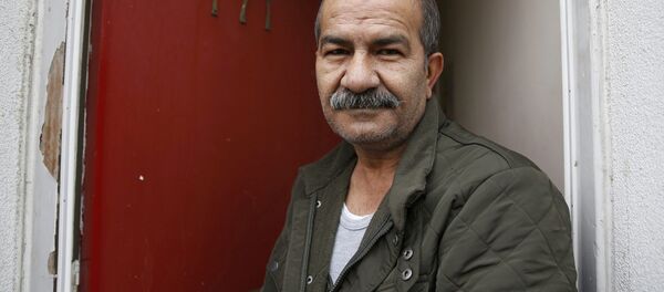 Iranian asylum seeker Mohammed Bagher Beyzevi poses for a photograph outside his home on Union Street in Middlesbrough, northern Britain, in this file photograph dated January 20, 2016. Iranian asylum seeker Mohammed Bagher Beyzevi poses for a photograph outside his home on Union Street in Middlesbrough, northern Britain, in this file photograph dated January 20, 2016. - Sputnik International