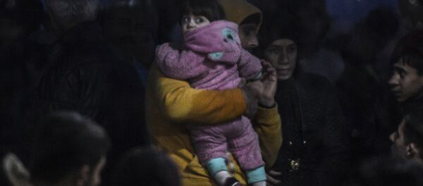 Syrian refugees are detained by the Turkish coastguard after they tried to reach the Greek island of Lesbos on March 3, 2016, Kucukkuyu, Canakkale. Syrian refugees are detained by the Turkish coastguard after they tried to reach the Greek island of Lesbos on March 3, 2016, Kucukkuyu, Canakkale. - Sputnik International