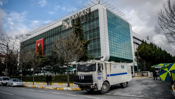 A water cannon of the Turkish police is parked in front of the headquarters of Turkish daily newspaper Zaman in Istanbul on March 5, 2016, after Turkish authorities seized the headquarters in a midnight raid - Sputnik International