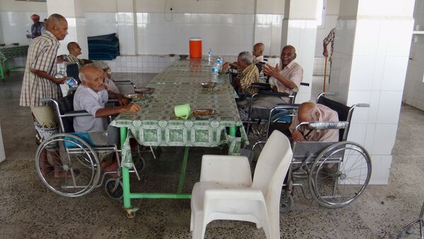 Elderly residents of an old people's home sit in the home's dinning hall after it was attacked by gunmen in the Yemeni port of Aden March 4, 2016 - Sputnik International