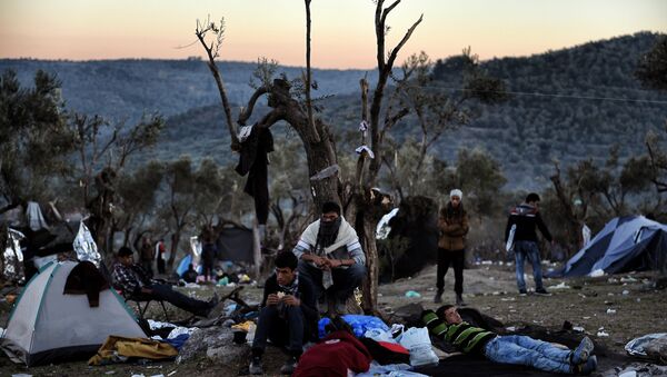 Refugees and migrants live at a field outside the Moria Hot Spot on the Greek Lesbos island on November 12, 2015 - Sputnik International
