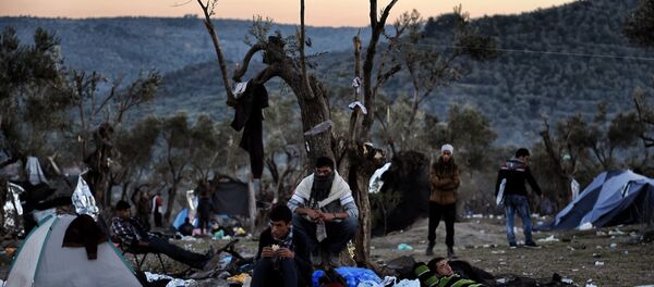 Refugees and migrants live at a field outside the Moria Hot Spot on the Greek Lesbos island on November 12, 2015 - Sputnik International