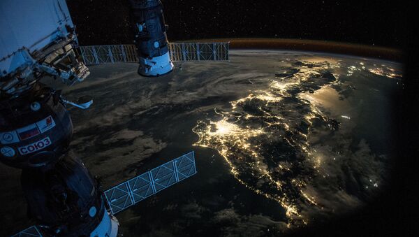 Night Earth observation of Japan taken by Expedition 44 crewmember Scott Kelly, with a Soyuz Spacecraft connected to the Mini Research Module 1 (MRM1), and a Progress Spacecraft visible - Sputnik International