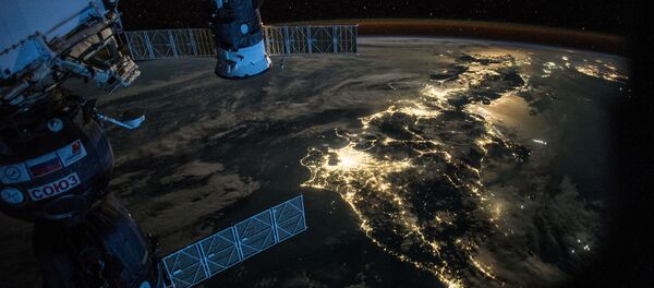 Night Earth observation of Japan taken by Expedition 44 crewmember Scott Kelly, with a Soyuz Spacecraft connected to the Mini Research Module 1 (MRM1), and a Progress Spacecraft visible - Sputnik International