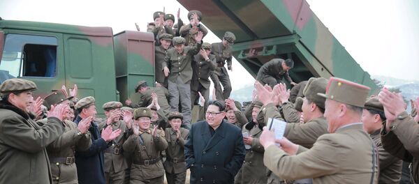 North Korean leader Kim Jong Un (C) smiles as he guides a test fire of a new multiple launch rocket system in this undated photo released by North Korea's Korean Central News Agency (KCNA) in Pyongyang March 4, 2016 North Korean leader Kim Jong Un (C) smiles as he guides a test fire of a new multiple launch rocket system in this undated photo released by North Korea's Korean Central News Agency (KCNA) in Pyongyang March 4, 2016 - Sputnik International
