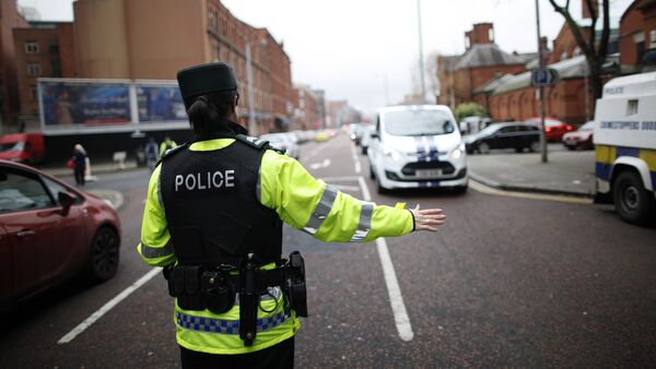 A police officer checks vehicles in South Belfast, Northern Ireland. File photo - Sputnik International