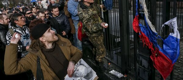 Protesters throw eggs towards a building of the Russian embassy during a rally demanding the liberation of Ukrainian army pilot Nadezhda Savchenko by Russia, in Kiev, Ukraine, March 6, 2016 Protesters throw eggs towards a building of the Russian embassy during a rally demanding the liberation of Ukrainian army pilot Nadezhda Savchenko by Russia, in Kiev, Ukraine, March 6, 2016 - Sputnik International