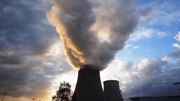 Steam rises at sunset from the cooling towers of the Electricite de France (EDF) nuclear power station at Nogent-Sur-Seine, France, November 13, 2015. - Sputnik International