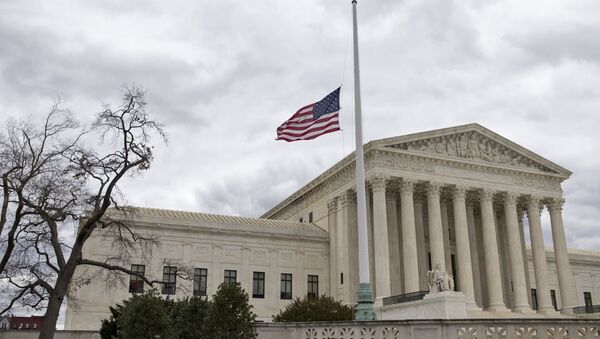 In this Feb. 25, 2016, file photo, in honor of Justice Antonin Scalia, a flag in the Supreme Court building's front plaza flies at half-staff in Washington - Sputnik International