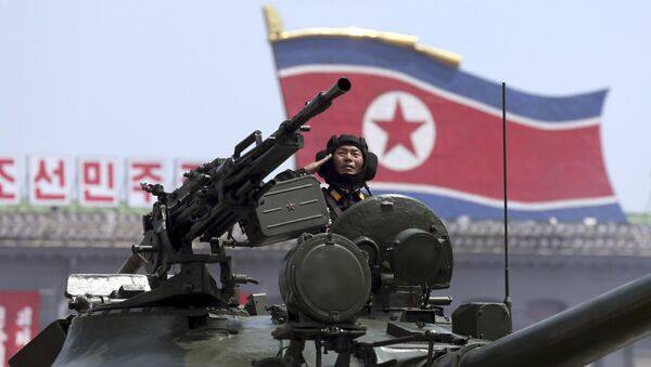 In this Saturday, July, 27, 2013, file photo, a North Korean soldier salutes while in a military tank as they parade through Kim Il Sung Sqaure during a mass military parade celebrating the 60th anniversary of the Korean War armistice in Pyongyang, North Korea - Sputnik International
