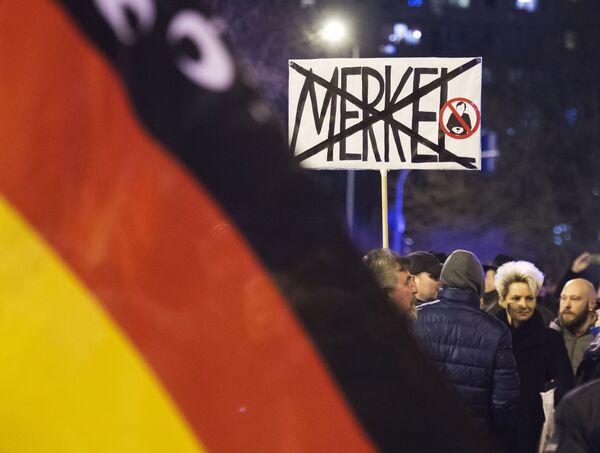 People wave German flags in Erfurt, central Germany,during a demonstration initiated by the Alternative for Germany (AfD) party against the immigration situation. People wave German flags in Erfurt, central Germany,during a demonstration initiated by the Alternative for Germany (AfD) party against the immigration situation. - Sputnik International