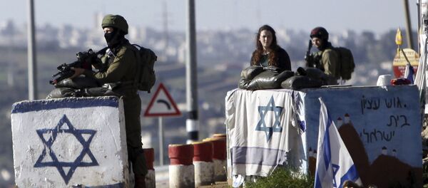 Israeli soldiers stand guard at Gush Etzion junction in the West Bank Friday, March 4, 2016 Israeli soldiers stand guard at Gush Etzion junction in the West Bank Friday, March 4, 2016 - Sputnik International