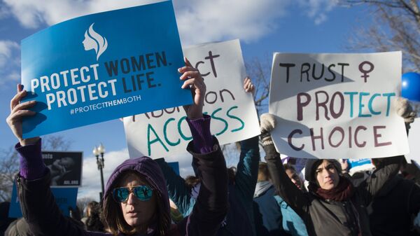 Supporters of legal access to abortion rally outside the Supreme Court in Washington, DC, March 2, 2016, as the Court hears oral arguments in the case of Whole Woman's Health v. Hellerstedt, which deals with access to abortion - Sputnik International