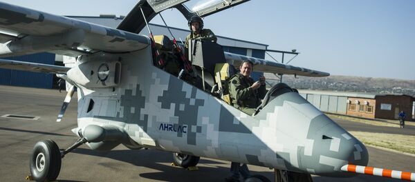 Pilots of the AHRLAC (Advanced High-Performance Reconnaissance Light Aircraft), designed by Paramount Group, Africa's largest privately-owned defence and aerospace company, look on within the first public flight of Africa's first wholly designed and built military fixed wing aircraft, at the Wonderboom airport in Pretoria on August 13, 2014 Pilots of the AHRLAC (Advanced High-Performance Reconnaissance Light Aircraft), designed by Paramount Group, Africa's largest privately-owned defence and aerospace company, look on within the first public flight of Africa's first wholly designed and built military fixed wing aircraft, at the Wonderboom airport in Pretoria on August 13, 2014 - Sputnik International