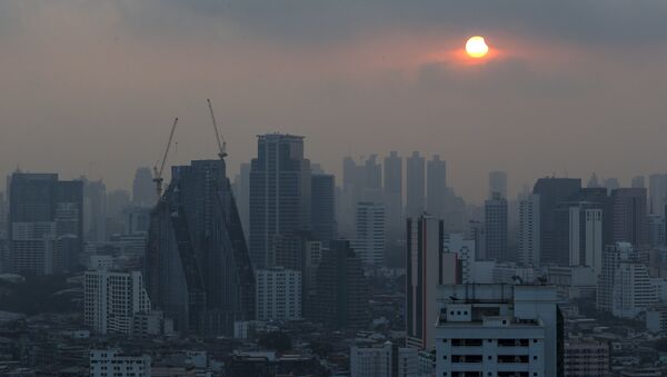 A partial solar eclipse is seen in Bangkok, Thailand, March 9, 2016. - Sputnik International