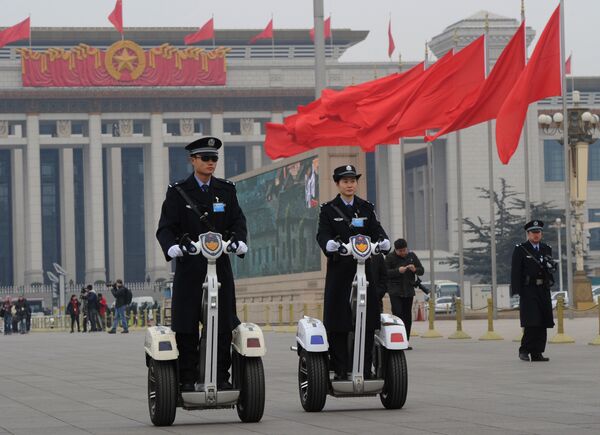Police patrol outside the Great Hall of the People before the opening session at the 11th National Committee of the Chinese People's Political Consultative Conference (CPPCC) in Beijing on March 3, 2012. Police patrol outside the Great Hall of the People before the opening session at the 11th National Committee of the Chinese People's Political Consultative Conference (CPPCC) in Beijing on March 3, 2012. - Sputnik International
