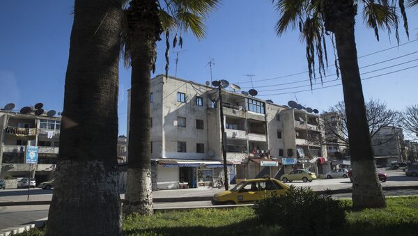 In this photo taken on Tuesday, March 1, 2016, a car passes on a street in Latakia, Syria. Associated Press spent five days traveling through the port of Latakia in Syria during the ceasefire. - Sputnik International