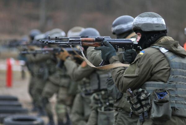 Ukraine's National Guard soldiers during combat training developed by NATO at a training ground in the Zolochevsky District, Lviv Region. Ukraine's National Guard soldiers during combat training developed by NATO at a training ground in the Zolochevsky District, Lviv Region. - Sputnik International