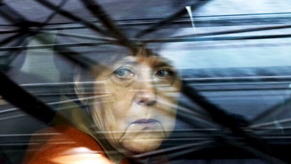 In this file photo Germany's Chancellor Angela Merkel arrives at an EU-Turkey summit in Brussels, as the bloc is looking to Ankara to help it curb the influx of refugees and migrants flowing into Europe, March 7, 2016. - Sputnik International