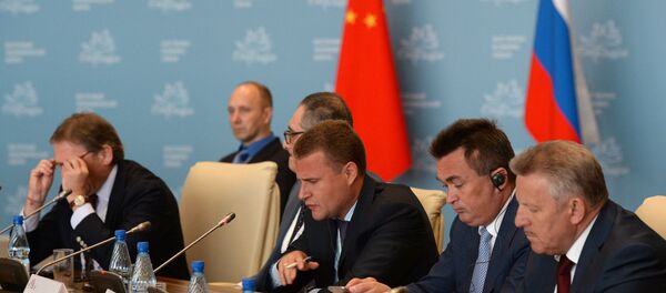 Alexei Chekunkov (center), CEO, JSC Far East and Baikal Region Development Fund, attends the Country Dialogue Russia-China at the Eastern Economic Forum in Vladivostok Alexei Chekunkov (center), CEO, JSC Far East and Baikal Region Development Fund, attends the Country Dialogue Russia-China at the Eastern Economic Forum in Vladivostok - Sputnik International