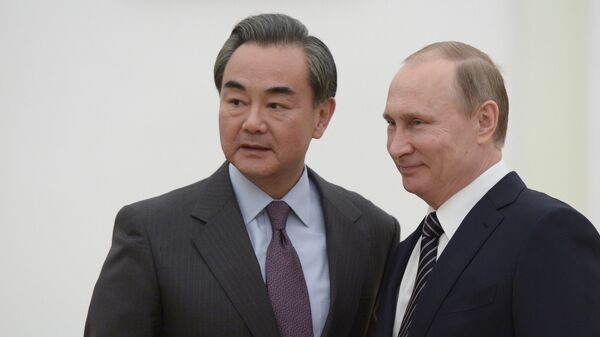 President Vladimir Putin, right, and Chinese Foreign Minister Wang Yi meeting at the Kremlin - Sputnik International