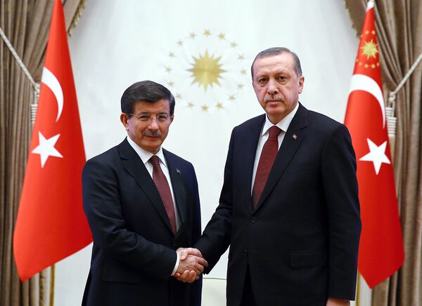 A handout image made available by the Turkish Presidential Press Office on January 29, 2015, shows Turkish President Recep Tayyip Erdogan (R) shaking hands with Turkish Prime Minister Ahmet Davutoglu at Presidential Palace in Ankara. A handout image made available by the Turkish Presidential Press Office on January 29, 2015, shows Turkish President Recep Tayyip Erdogan (R) shaking hands with Turkish Prime Minister Ahmet Davutoglu at Presidential Palace in Ankara. - Sputnik International