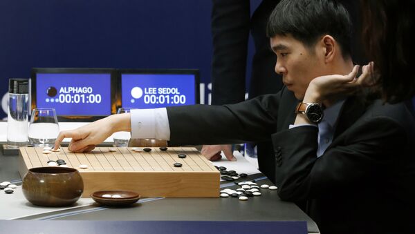 South Korean professional Go player Lee Sedol reviews the match himself after finishing the second match of the Google DeepMind Challenge Match against Google's artificial intelligence program, AlphaGo in Seoul, South Korea, Thursday, March 10, 2016 - Sputnik International