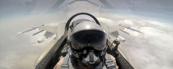 A handout image made available on September 11, 2015 by the United Arab Emirates News Agency (WAM) at taken at an undisclosed location shows a pilot sitting in a cockpit of a fighter jet of the UAE armed forces during raids against Shiite Huthi rebels in Yemen as part of the Saudi-led coalition’s Operation Decisive Storm A handout image made available on September 11, 2015 by the United Arab Emirates News Agency (WAM) at taken at an undisclosed location shows a pilot sitting in a cockpit of a fighter jet of the UAE armed forces during raids against Shiite Huthi rebels in Yemen as part of the Saudi-led coalition’s Operation Decisive Storm - Sputnik International