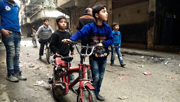 Children in Nubel, north of Aleppo province in Syria - Sputnik International