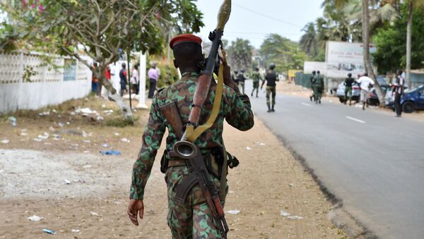 An armed soldier patrols in the streets of Grand Bassam, Ivory Coast, on March 14, 2016, a day after jihadist attackers stormed three hotels in the weekend resort. Ivory Coast ministers were to hold emergency talks on March 14 after the first jihadist attack in the country left 18 dead at a beach resort popular with foreigners, the latest such Islamist assault in West Africa - Sputnik International