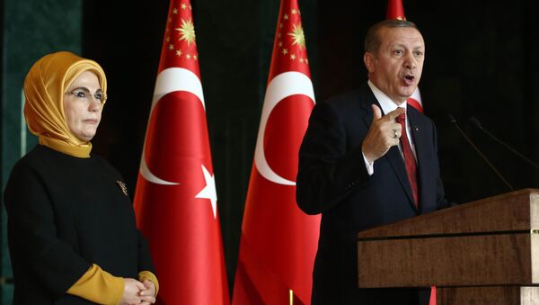 Turkish President Recep Tayyip Erdogan delivers a speech, flanked by his wife Emine (File) - Sputnik International