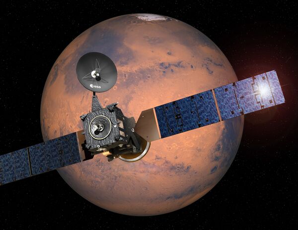 This image provided by the European Space Agency, ESA, shows an artist·s impression depicting the separation of the ExoMars 2016 entry, descent and landing demonstrator module, named Schiaparelli, from the Trace Gas Orbiter, and heading for Mars - Sputnik International